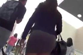 Nice ass girl in tight short skirt upskirt