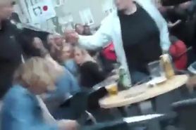 Drunk woman pissing on a bar terrace