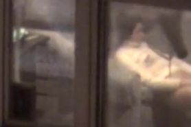 Lovely girl filmed masturbating through apartment window