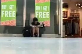 Sitting upskirt at the airport