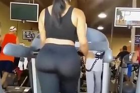 Big ass woman in tight sports pants at gym