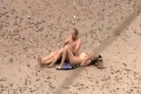 Old daddy tempts the young blonde on a beach