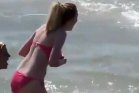 Big boobs teen in red bikini at beach