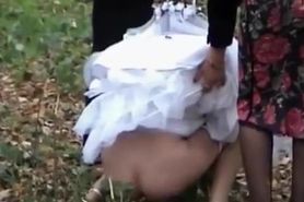 Bride needs help with dress to not piss on it