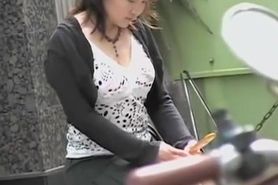 Busty Asian girl gets boob sharking while texting.