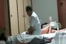 Asian massage with naked girl in the background