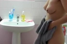 Woman secretly filmed by husband in bathroom