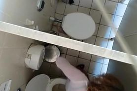 Hidden camera in public toilet ceiling