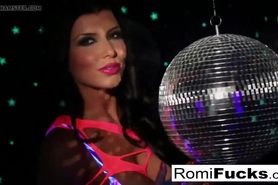 Romi plays with a disco ball before stuffing toying her