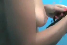 Spycam video of couple showering each other in beach cabin