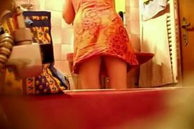 Spying a bent over wife in the bathroom