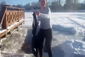 Brave Russian bimbo strips down to her underwear in snow