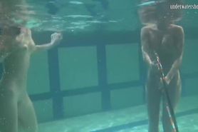 Russian babes Irina and Anna swim and hug in the pool