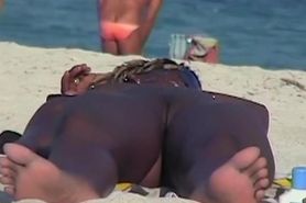 Hot beach handjob scene of tantalizing naked woman jerking husband.s penis