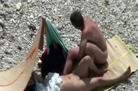Nudist couple spied having sex on the beach