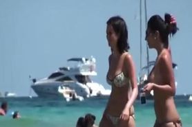 Two South European babes topless on the beach