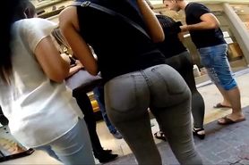 Amazing round ass brunette in tight jeans