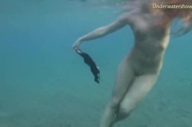Nude teen girl swims on Tenerife
