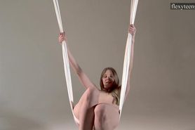 Young cute girl spreading legs and doing acrobatics
