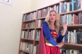 supergirl captured by a masked villainess in a black mini skirt & latex bra