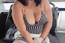 Milf with vibrator on the bus