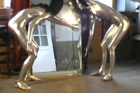 Lesbians completly painted in silver