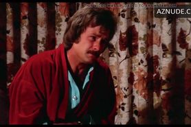 N. Riddell in 1974 movie in floral blue panties