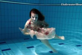 Russian girl Edwiga swims nude in the pool in Russia