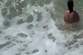 Small tits nudist swimming in the water