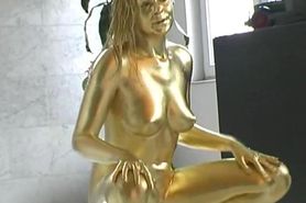 Golden painted Reneta luxuries posing