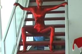 Strip in fullbody red catsuit