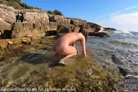 nude beach on vacation with big boob model