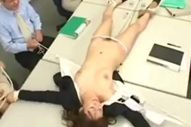 Asian business woman stripped by fellow office workers