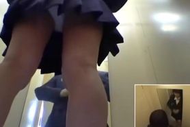 Schoolgirl in changing room tries on the new uniform