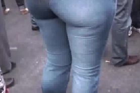 Sexy brunette round ass in pocketless jeans