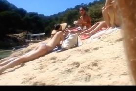 Topless friends at river beach