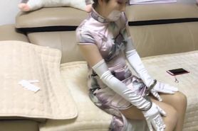 Fashionable chinese woman has fun with restraints
