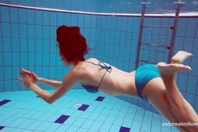 Tight blue swimsuit girl Martina in the pool