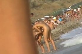 Sexy beach nudist girl spied talking on phone near water