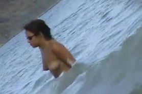 Fat ass big boobed woman is swimming at the summer beach