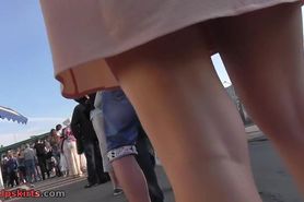 Appetizing ass of the delicious woman in upskirt scene