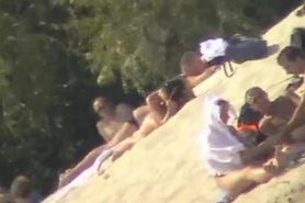 Busty nudist beach MILF caught on a hidden cam