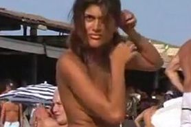 Cute girl topless at the beach
