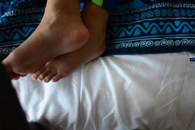 Giving step brother a footjob