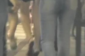 Sexy asses in jeans are filmed on a night out