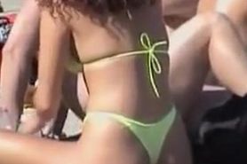 Bikini girl lying stretched on the beach candid video 06u