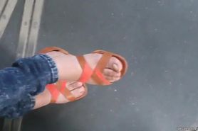 Teen with beautiful feet in the tramway