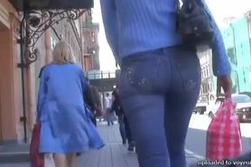 Candid street voyeur enjoys filming tight booties.