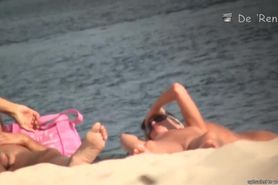 Bare pussy on a sandy beach exposed to crafty voyeur cameras