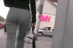Brunette with a fine ass works it before a candid street cam